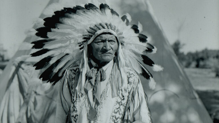 Chief High Eagle portrait outside his teepee 1946 copy
